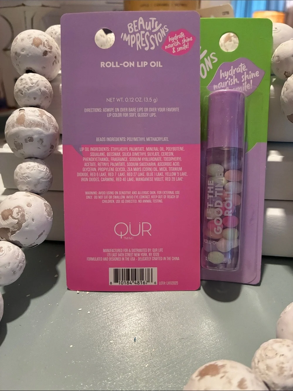 Impressions Roll-On Lip Oil Duo in Pink and Purple Packaging